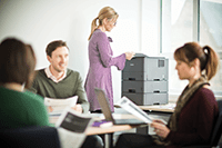 group of people sat with laser printer