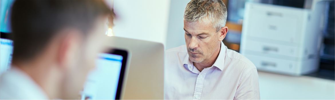 Two colleagues working on computers